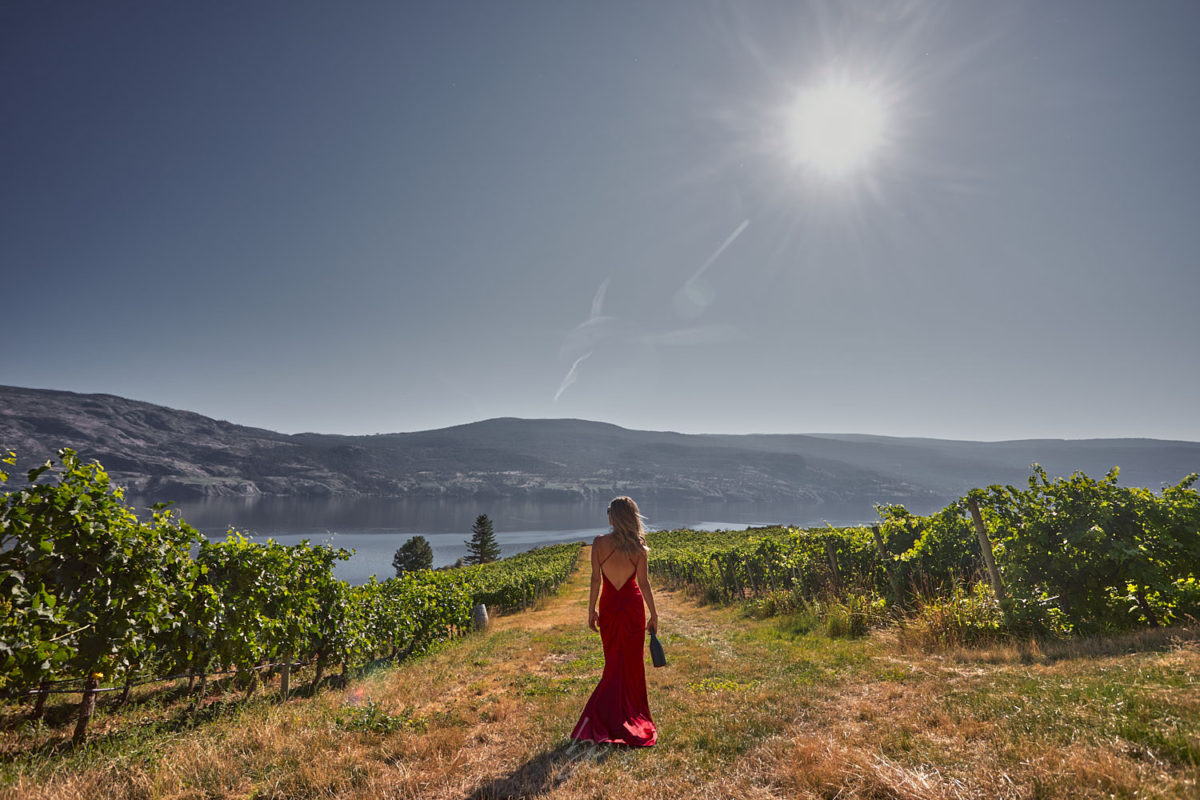 Lady in red dress by kelowna photographer of OAK estate winery