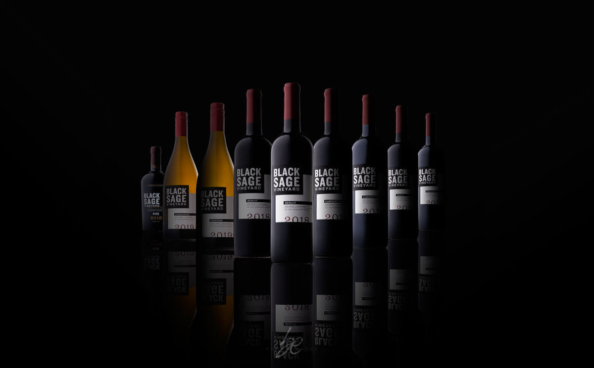 bottle lineup of black sage vineyard wines in studio by kelowna photographer brandon elliot